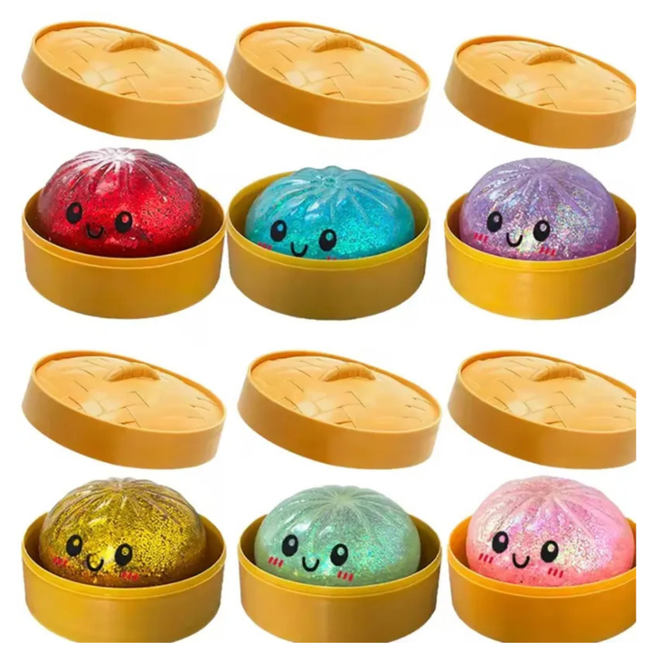Set of colorful glittery balls with smiling faces in yellow containers on a white background