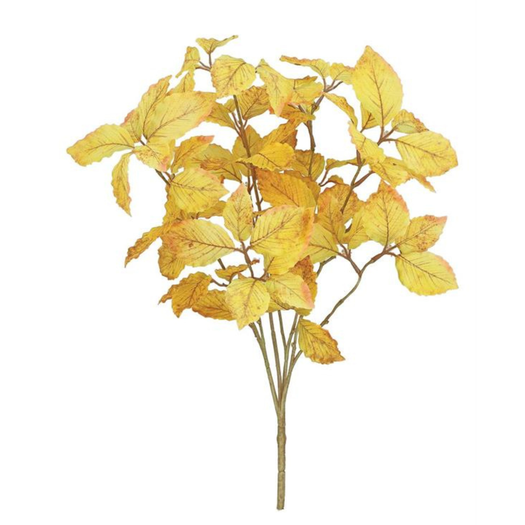 Artificial yellow leaf branch on a white background