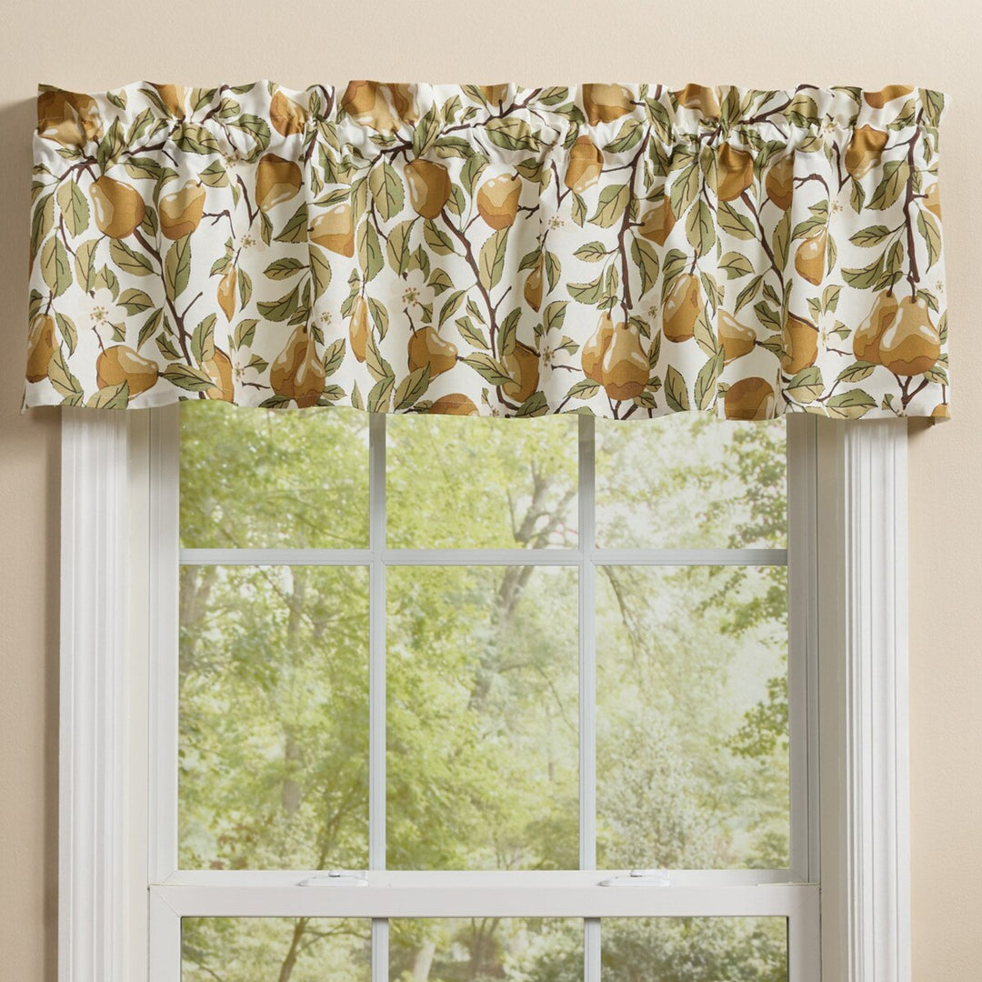 Window valance with pear pattern above a window