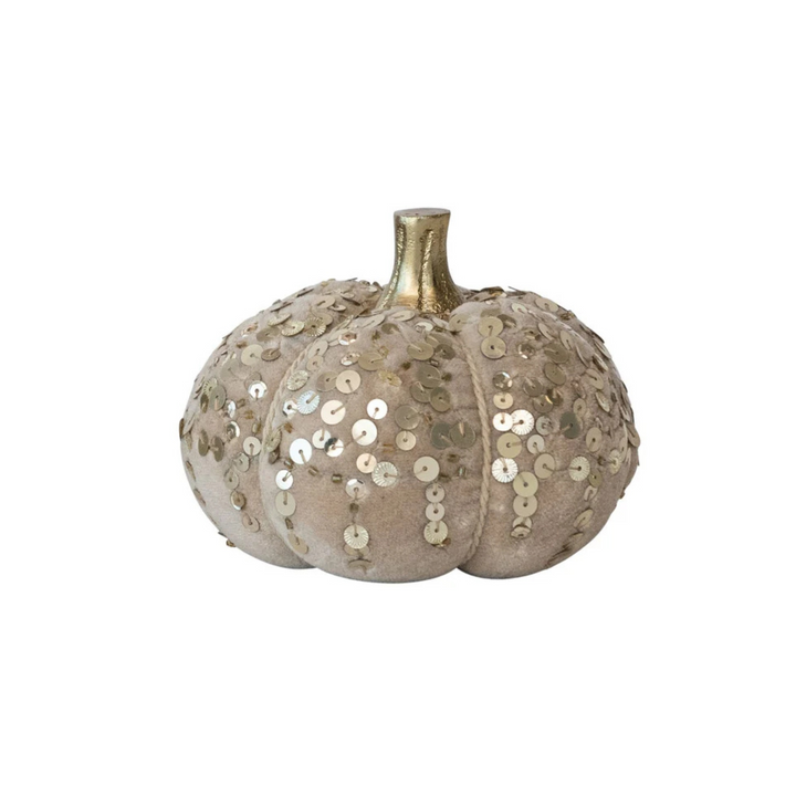 Decorative pumpkin with sequins on a white background