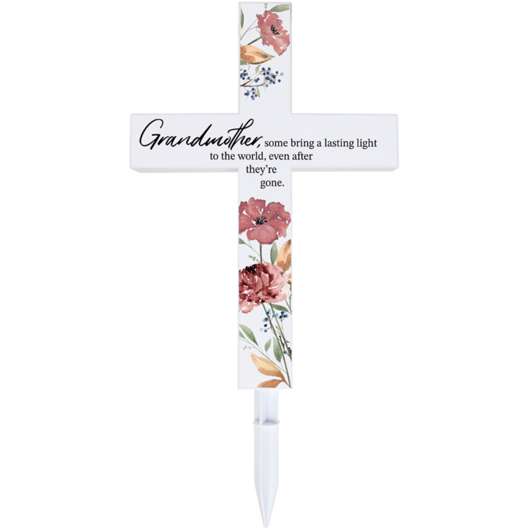 Decorative cross with floral design and text on a white background