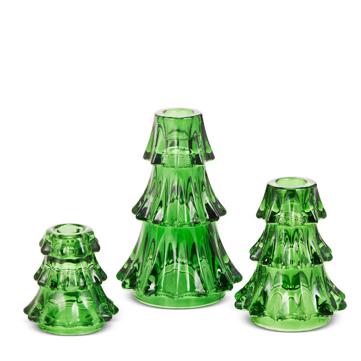 Three green glass candle holders shaped like miniature Christmas trees, displayed on a clean white background.