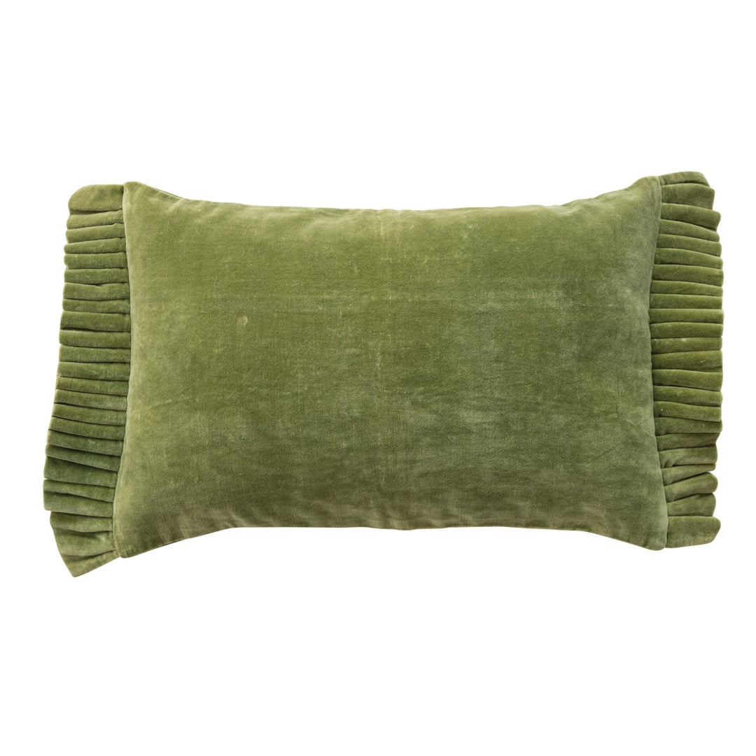 Green velvet pillow with pleated edge on a white background