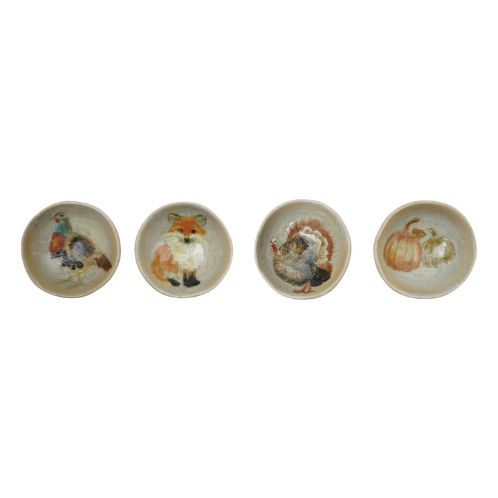 Set of ceramic bowls with animal illustrations on a white background