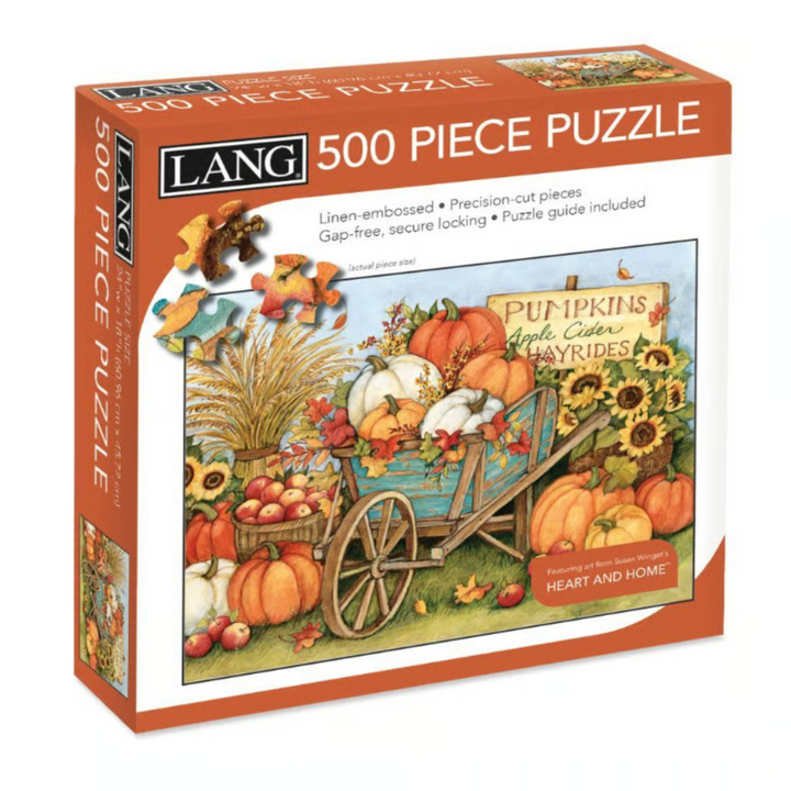Lang 500-piece jigsaw puzzle box featuring a fall harvest illustration with pumpkins, sunflowers, apples, and a wagon.