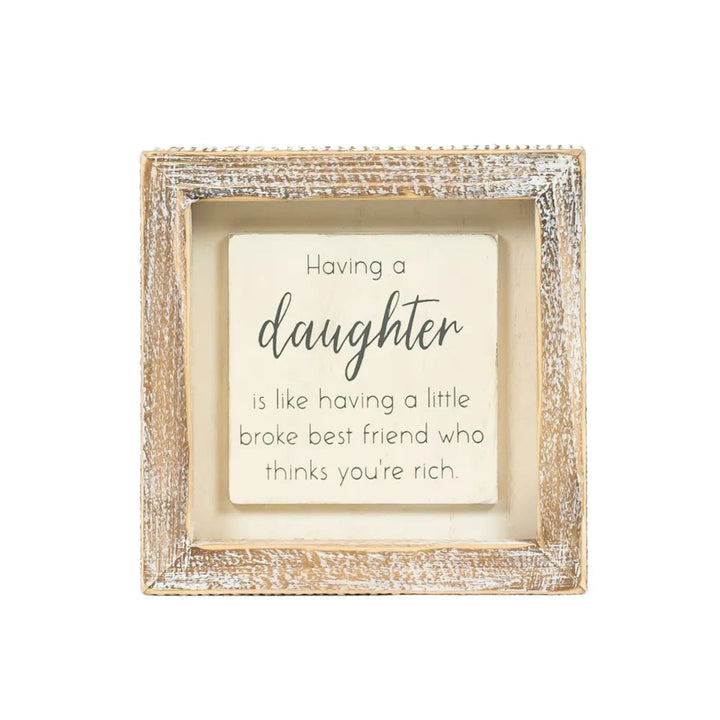 Decorative frame with a humorous quote about having a daughter on a white background