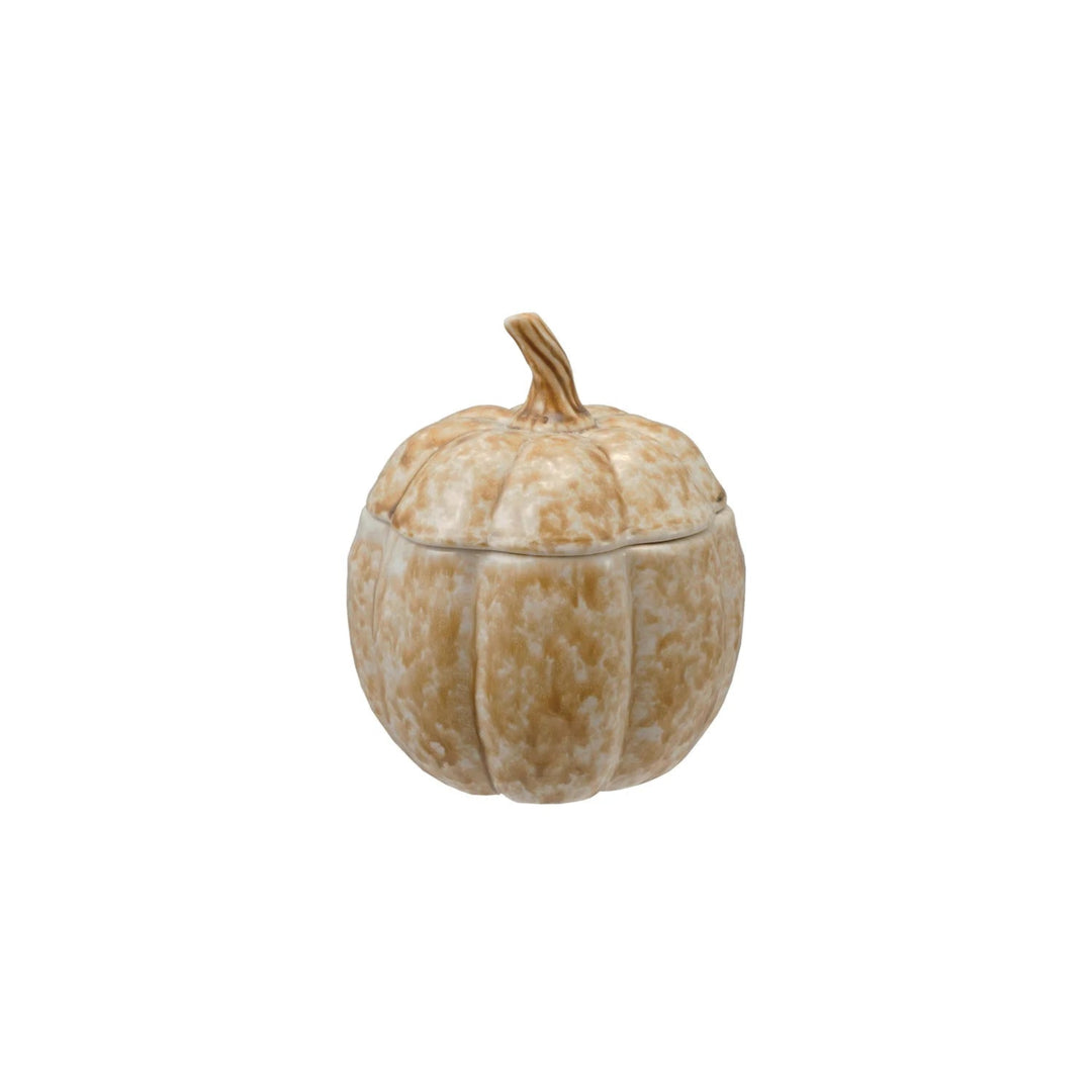 Decorative pumpkin-shaped container with a lid on a white background