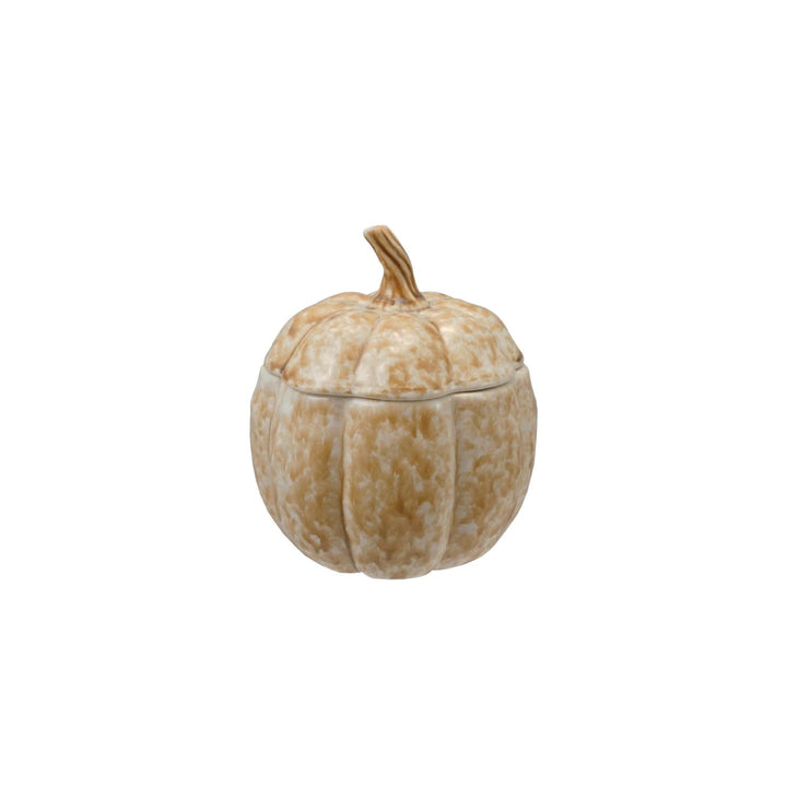 Decorative pumpkin-shaped container with a lid on a white background