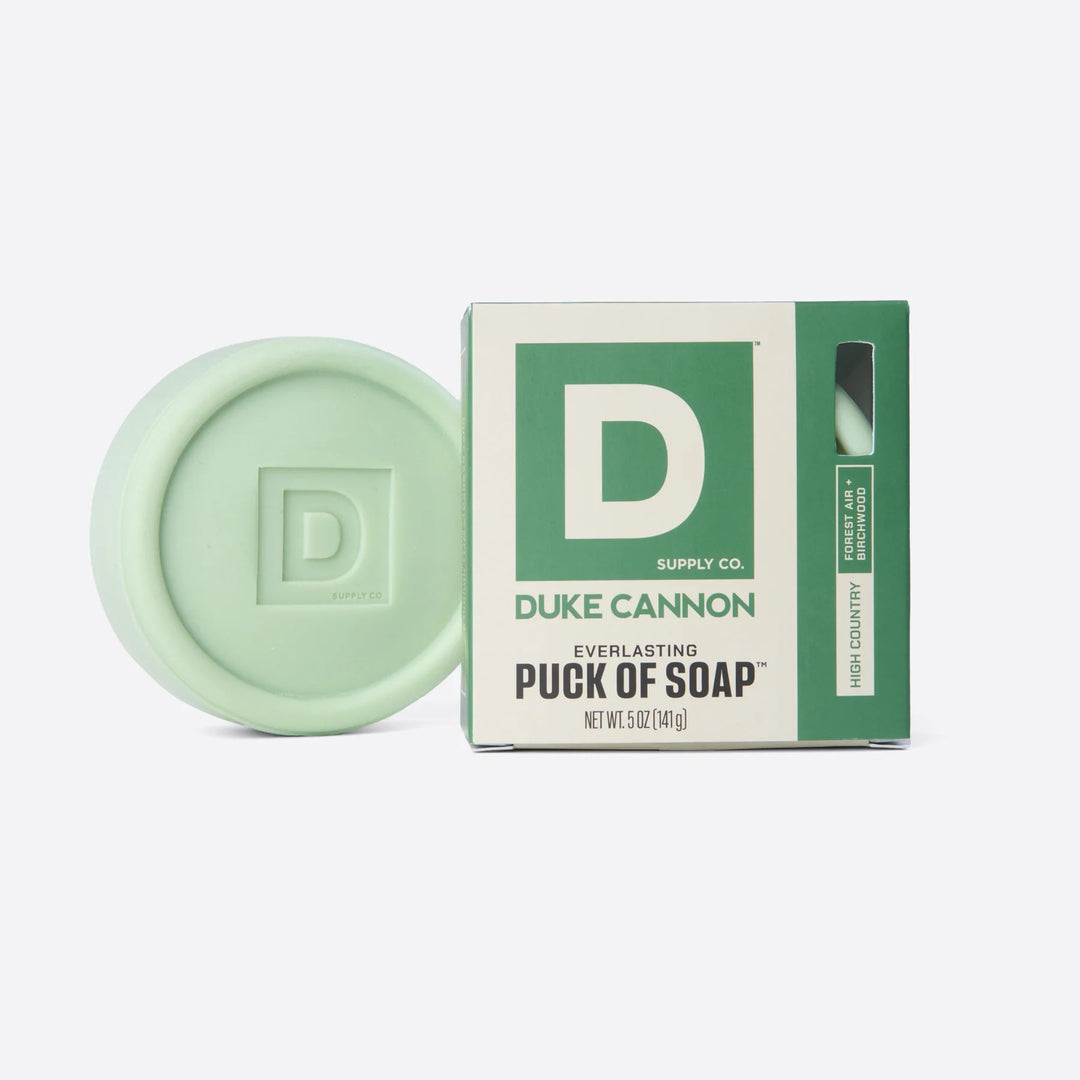 Green soap puck with Duke Cannon packaging on a white background