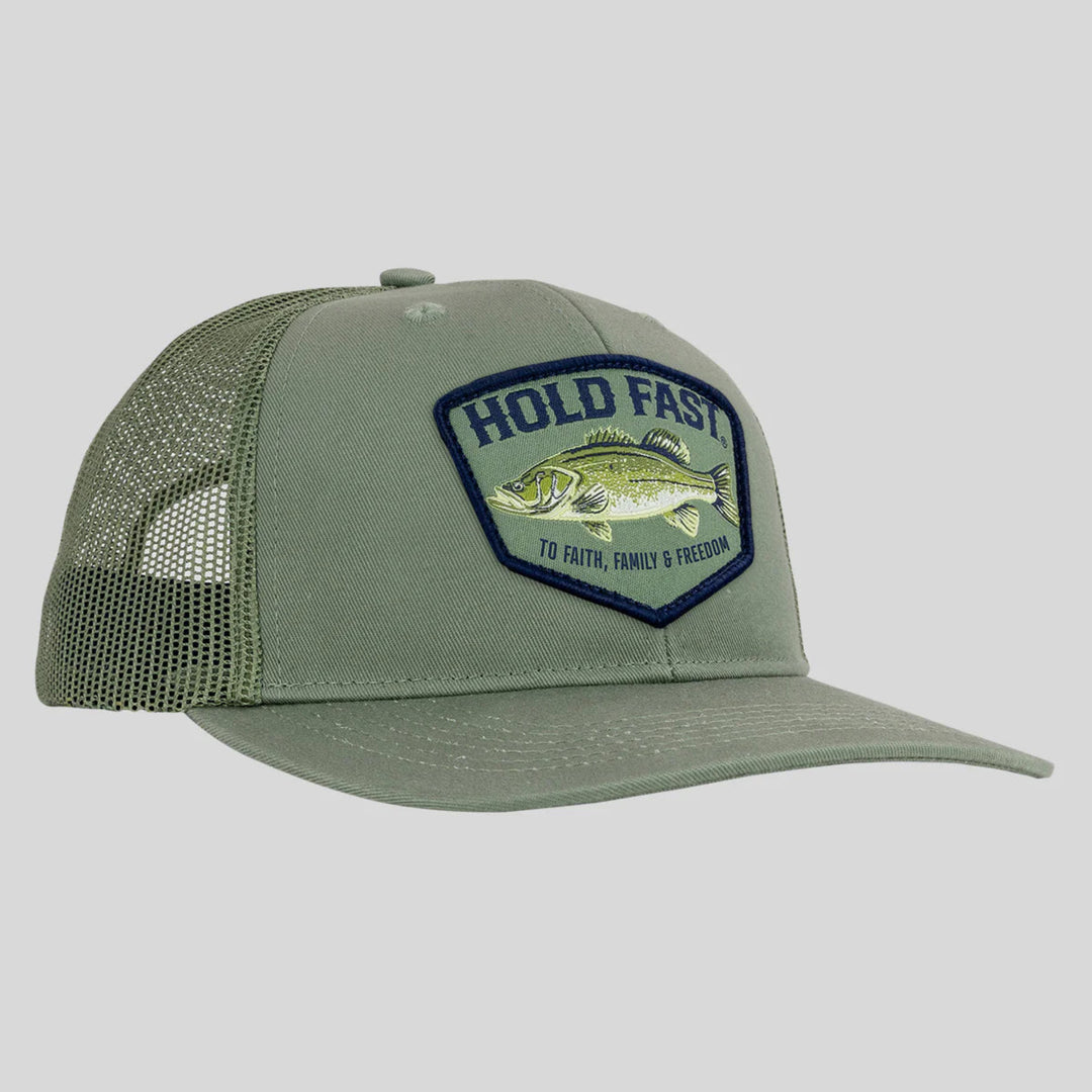 Green cap with a fish and text patch on a light gray background