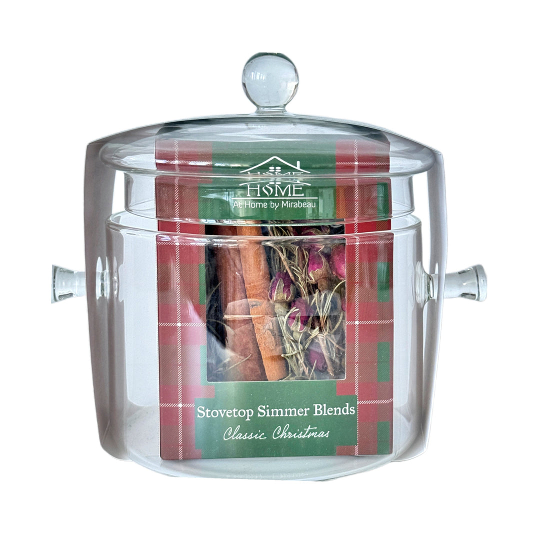 A clear glass stovetop simmer candle jar with a matching glass lid, featuring a front label for 'HOME by Raritan' scented with 'Stovetop Simmer Blends - Classic Christmas'.