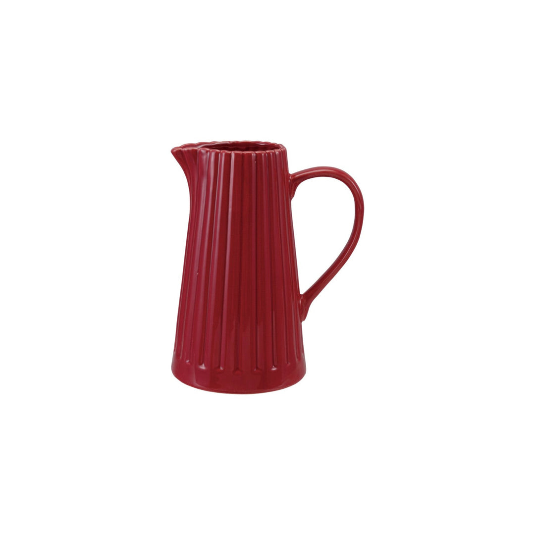 Red ceramic pitcher on a white background