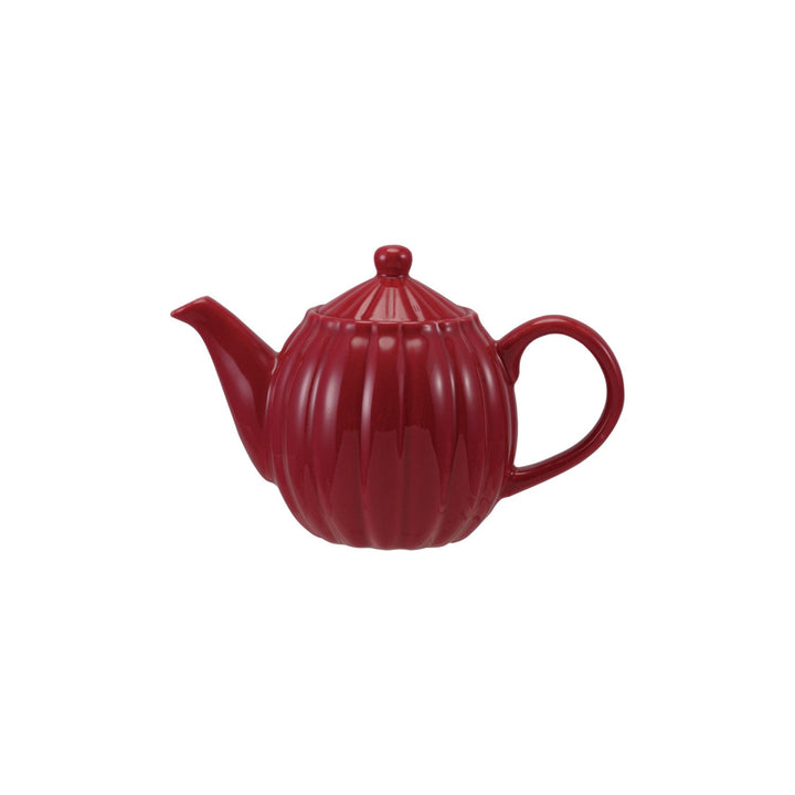 Red teapot on a white background
