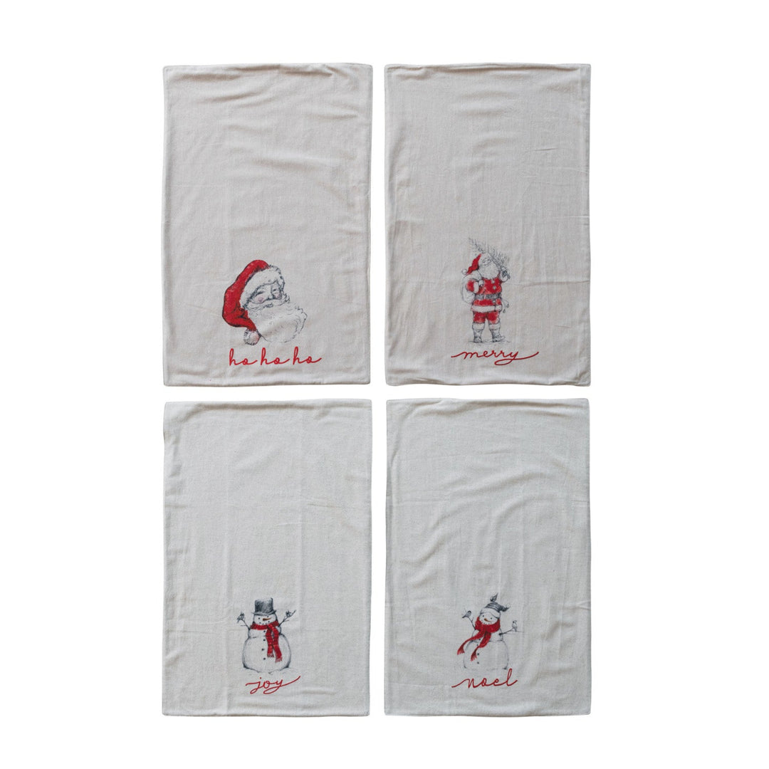 Four white towels with embroidered Christmas-themed designs on a white background