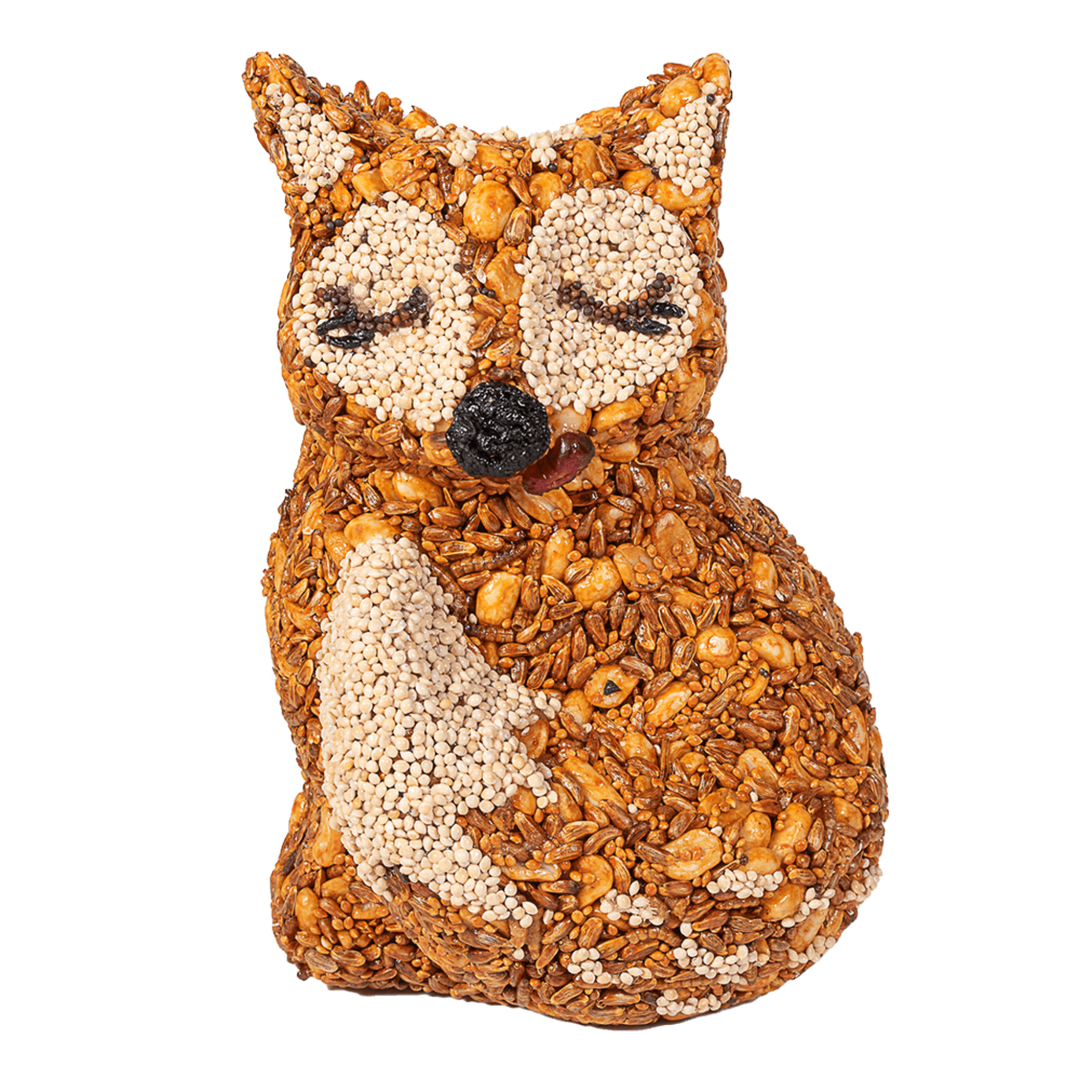 Fox-shaped decorative item made of seeds and grains on a black background