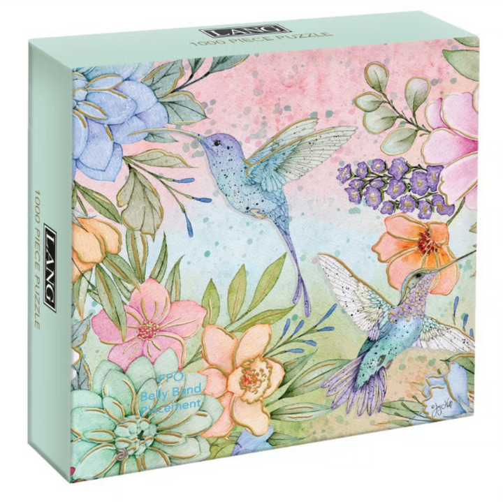 A 1000-piece jigsaw puzzle box by F&L NORDIC PICS, featuring a watercolor-style illustration of two hummingbirds among pastel-colored flowers and green leaves.