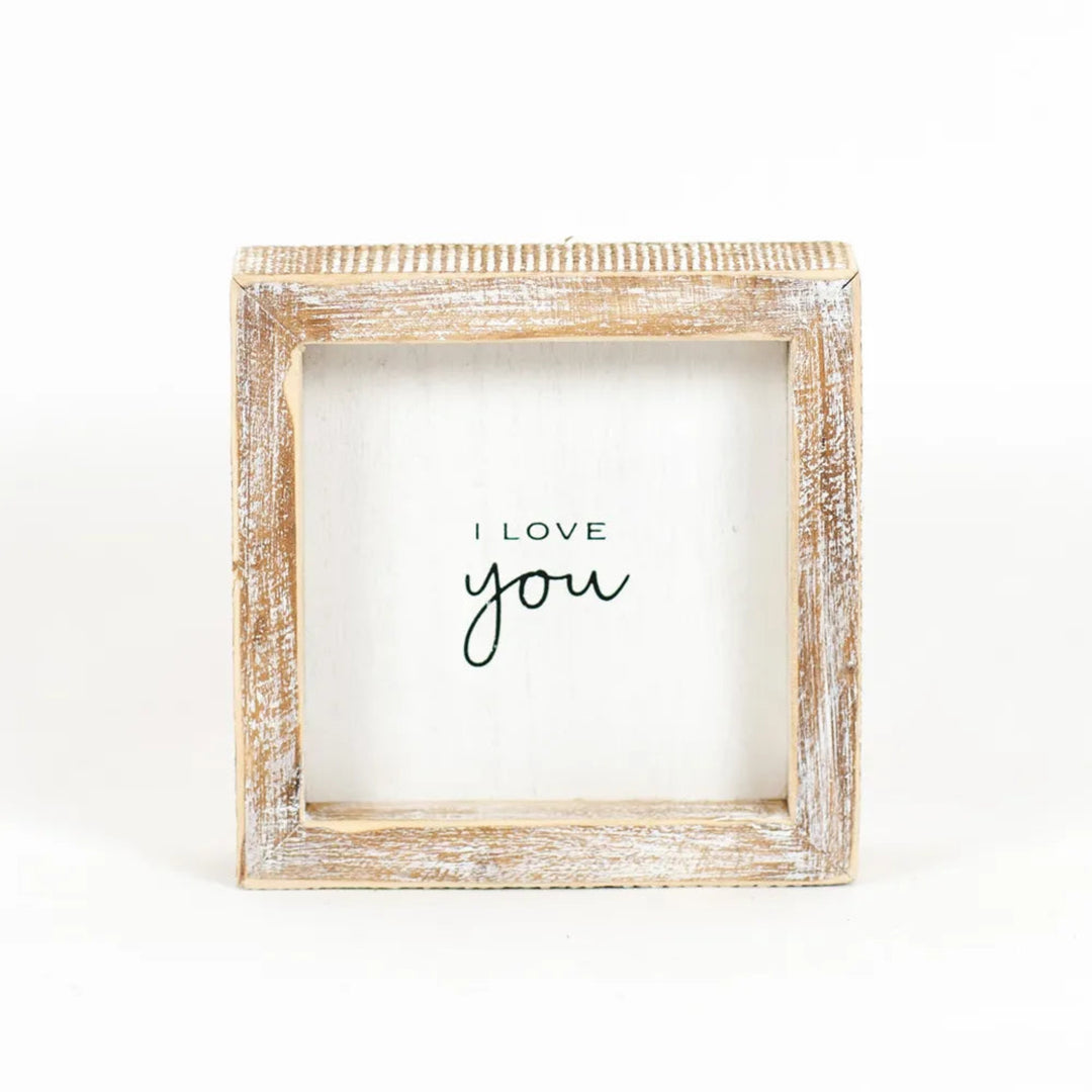 Wooden frame with 'I love you' text on a white background