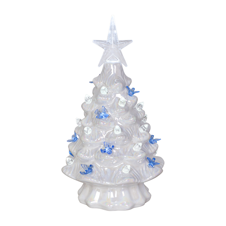 A white, translucent plastic Christmas tree with a star topper, decorated with small blue butterflies and clear round ornaments, shown against a plain white background.
