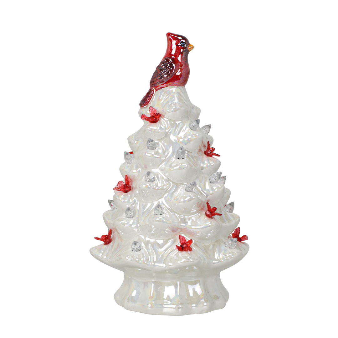 Decorative ceramic Christmas tree with a red cardinal on top against a white background