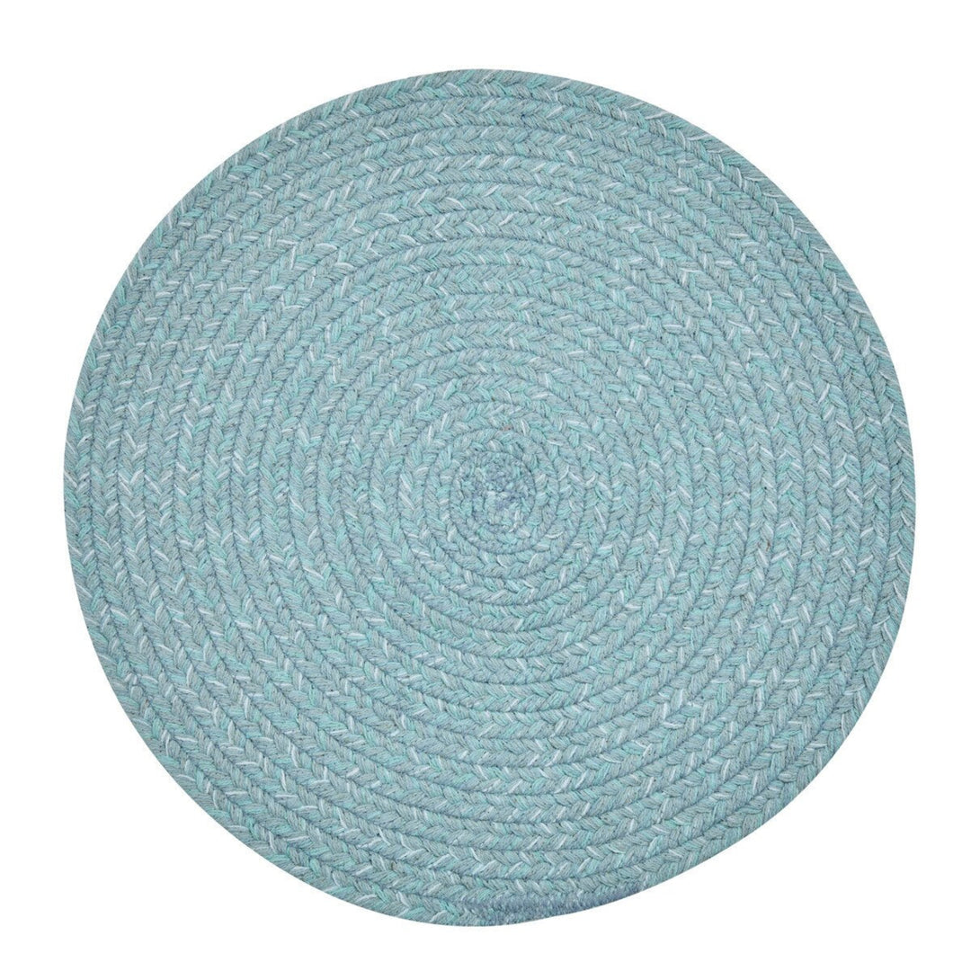 Round teal braided rug on a white background