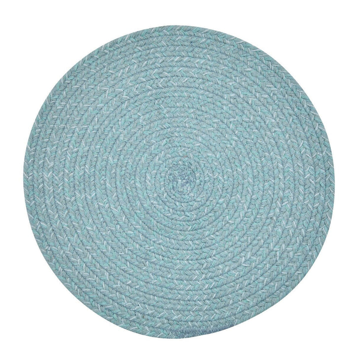 Round teal braided rug on a white background
