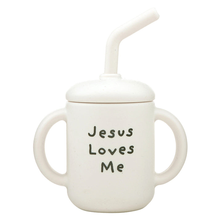 White sippy cup with 'Jesus Loves Me' text on a white background