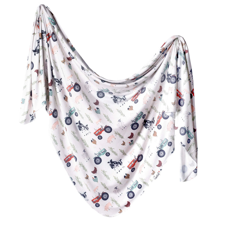 Baby blanket with vehicle pattern on a white background