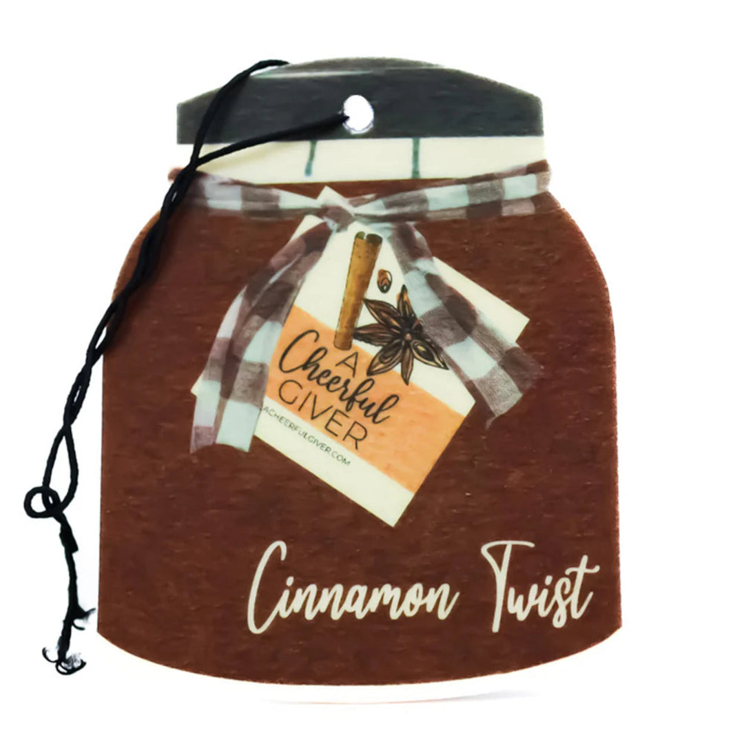 Cinnamon-scented jar with a decorative label on a white background