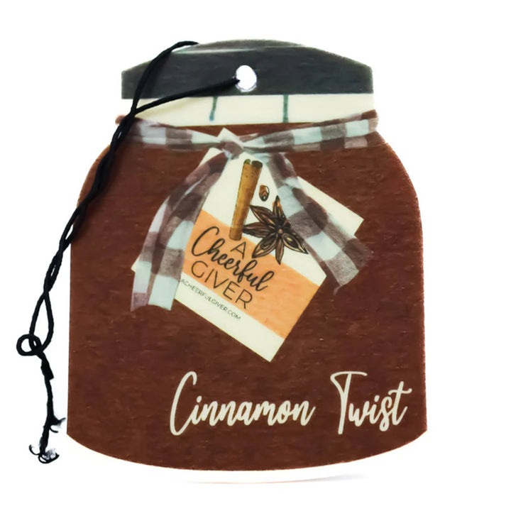 Cinnamon-scented jar with a decorative label on a white background
