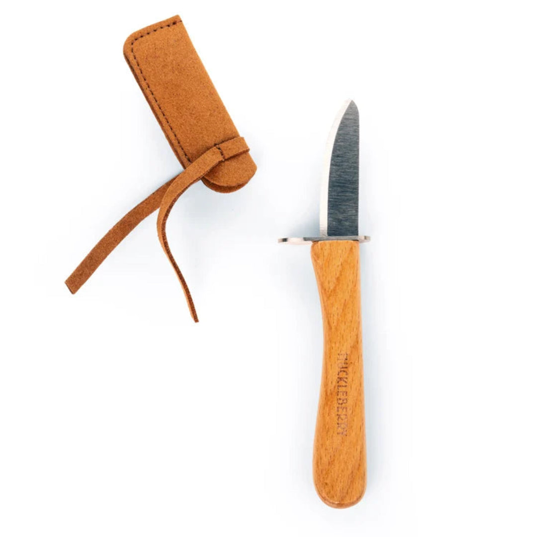 Knife with wooden handle and leather sheath on a white background