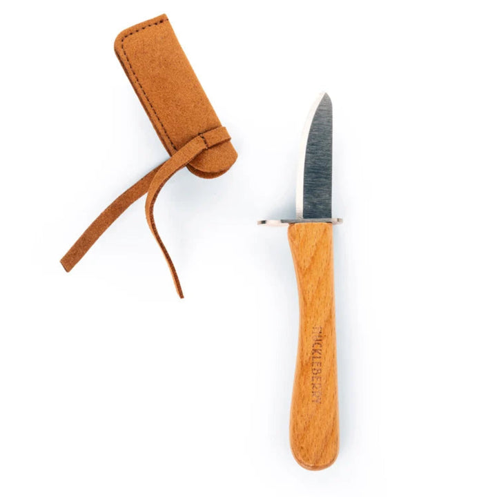 Knife with wooden handle and leather sheath on a white background