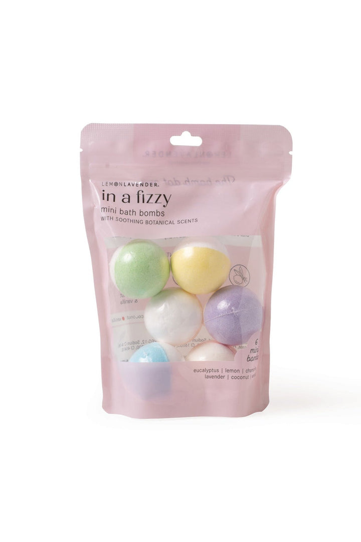 Pink packaging of 'in a fizzy' mini bath bombs with colorful bath bombs on a white background