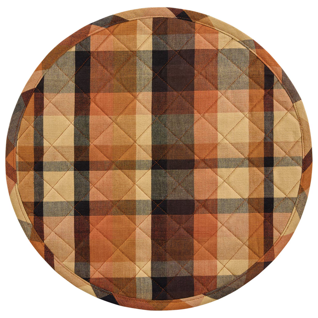 Round quilted placemat with a plaid pattern in autumn colors on a white background