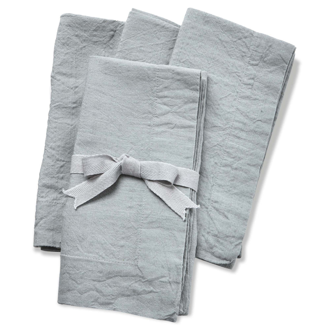 Set of gray folded towels with a ribbon on a white background