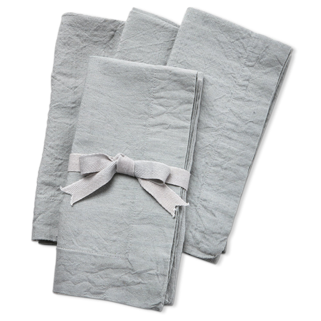 Set of three gray napkins with a ribbon on a white background