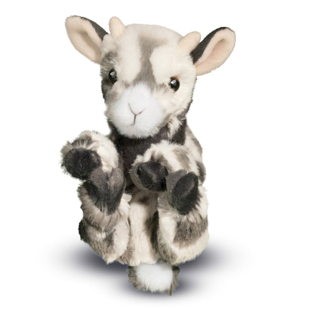 Plush toy goat with black and white pattern on a white background