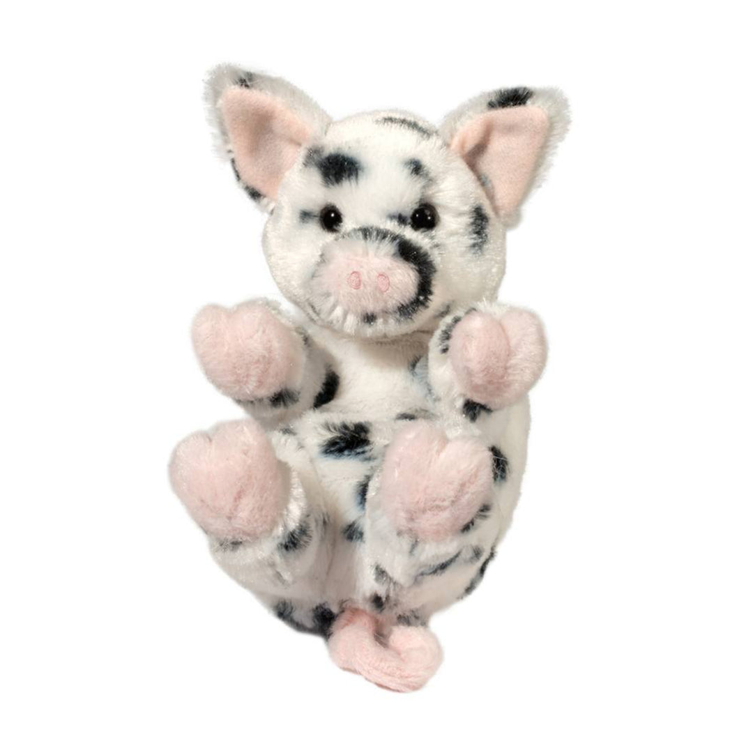 Plush toy pig with black spots on a white background