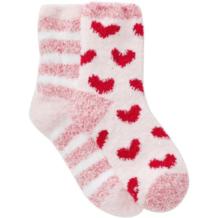 Pink and white sock with red heart patterns on a white background