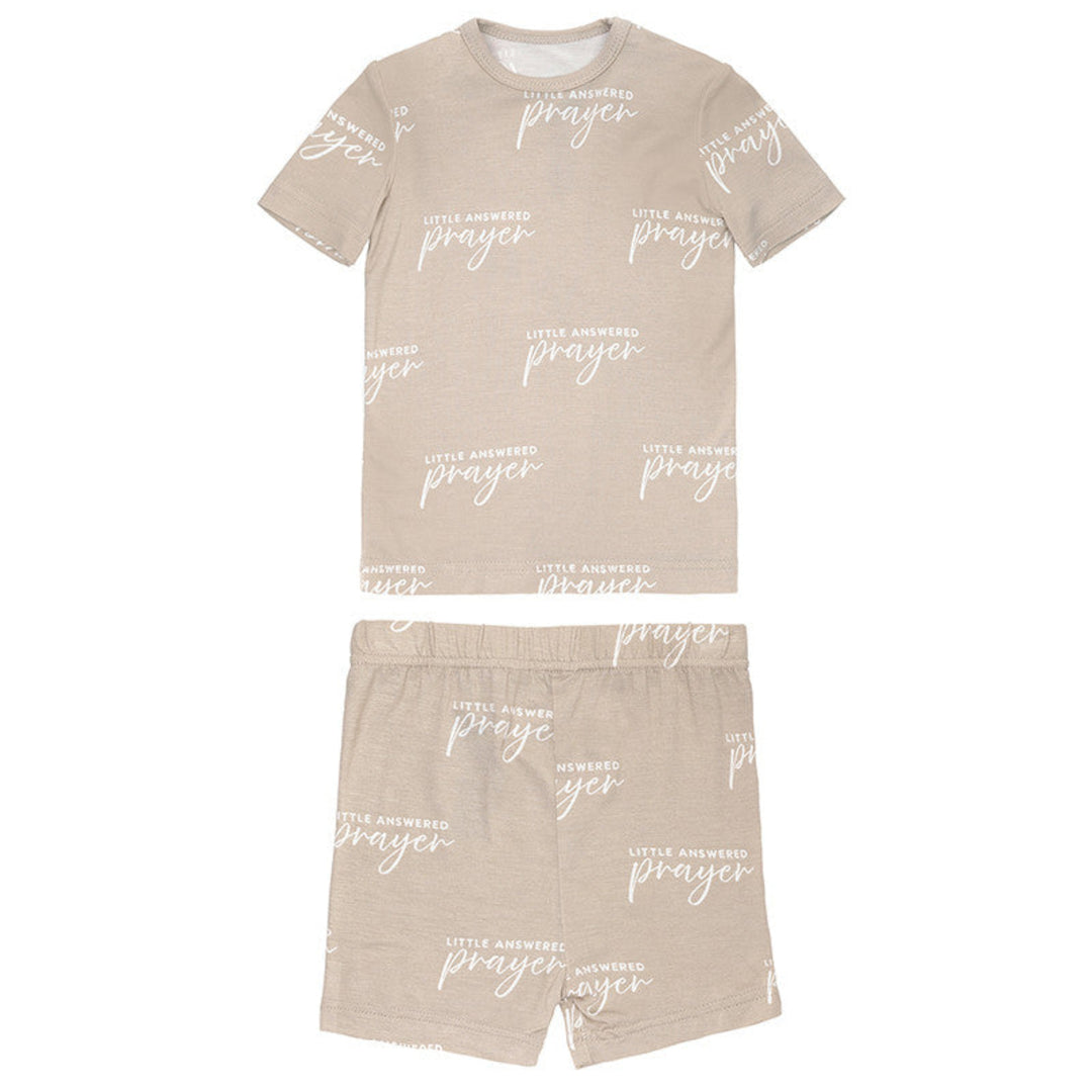 Beige t-shirt and shorts set with 'little answerer prayer' text on a white background