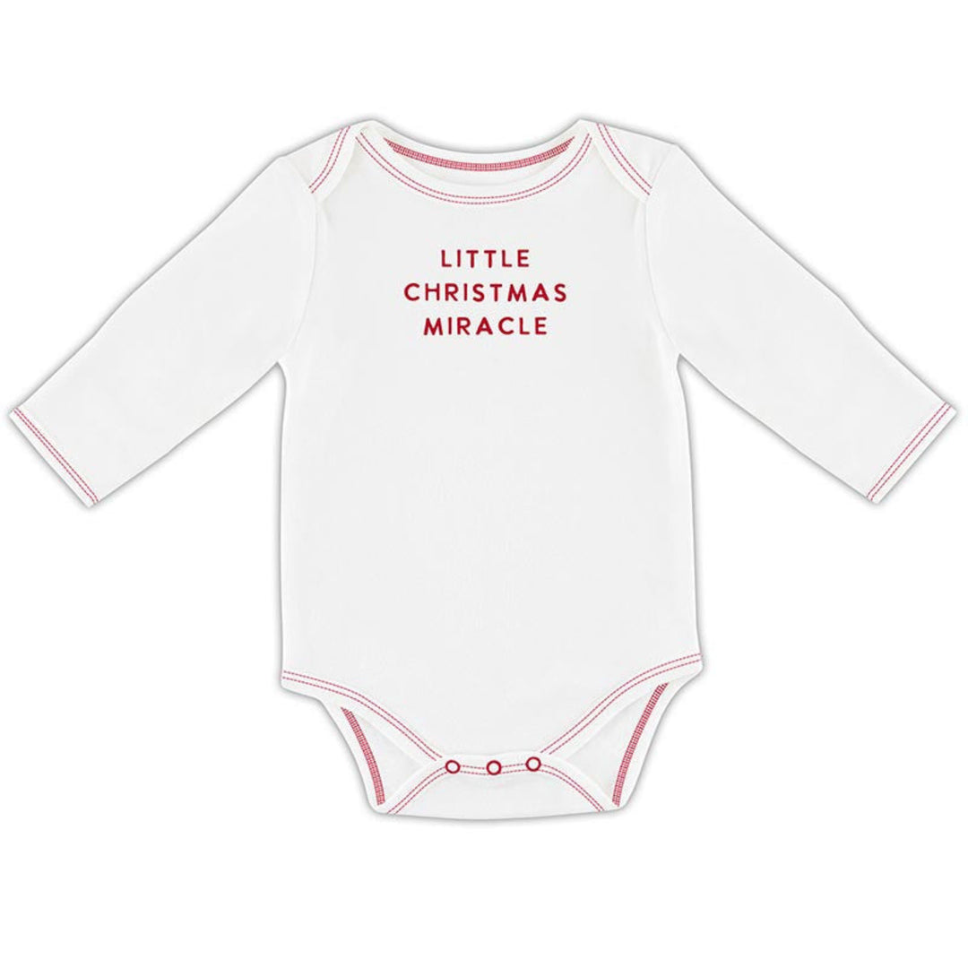 A white long-sleeve baby bodysuit with 'LITTLE CHRISTMAS MIRACLE' printed in red text on the chest, finished with red contrast stitching and snap closures at the crotch.