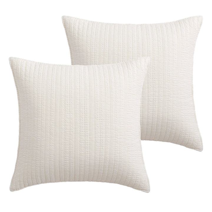 Two textured pillows on a white background