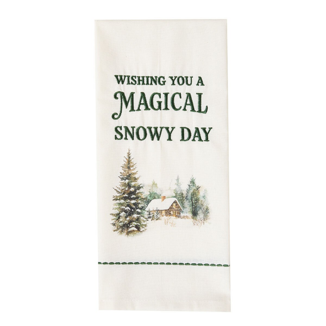 Decorative towel with Christmas scene and text 'Wishing you a Magical Snowy Day' on a white background