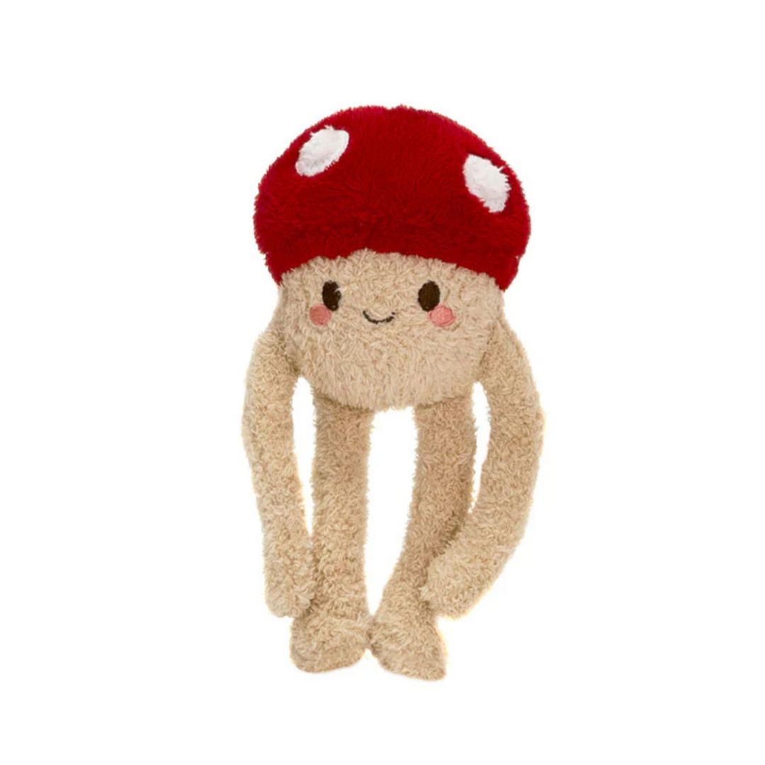 Stuffed toy with a red mushroom cap on a white background