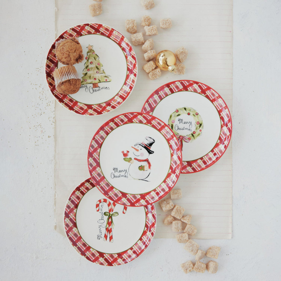 Set of Christmas-themed coasters with decorative elements on a white surface.