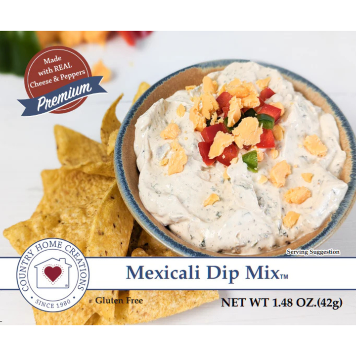 Bowl of Mexicali Dip Mix with tortilla chips on a white background, featuring Country Home Creations branding.