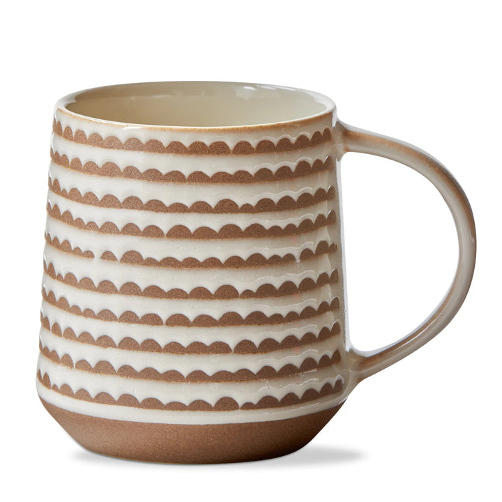 Ceramic mug with brown and white pattern on a white background
