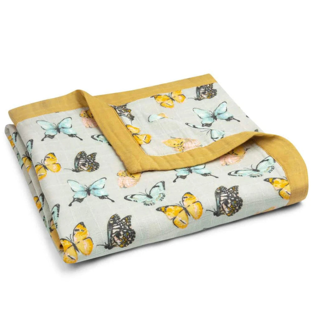 Folded blanket with butterfly pattern on a white background