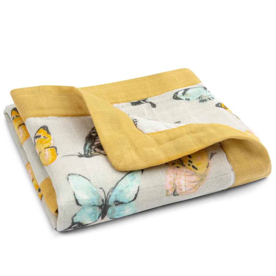 Folded blanket with butterfly pattern and yellow border on a white background