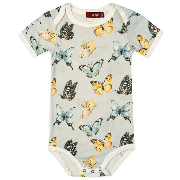 Baby onesie with butterfly pattern on a white background