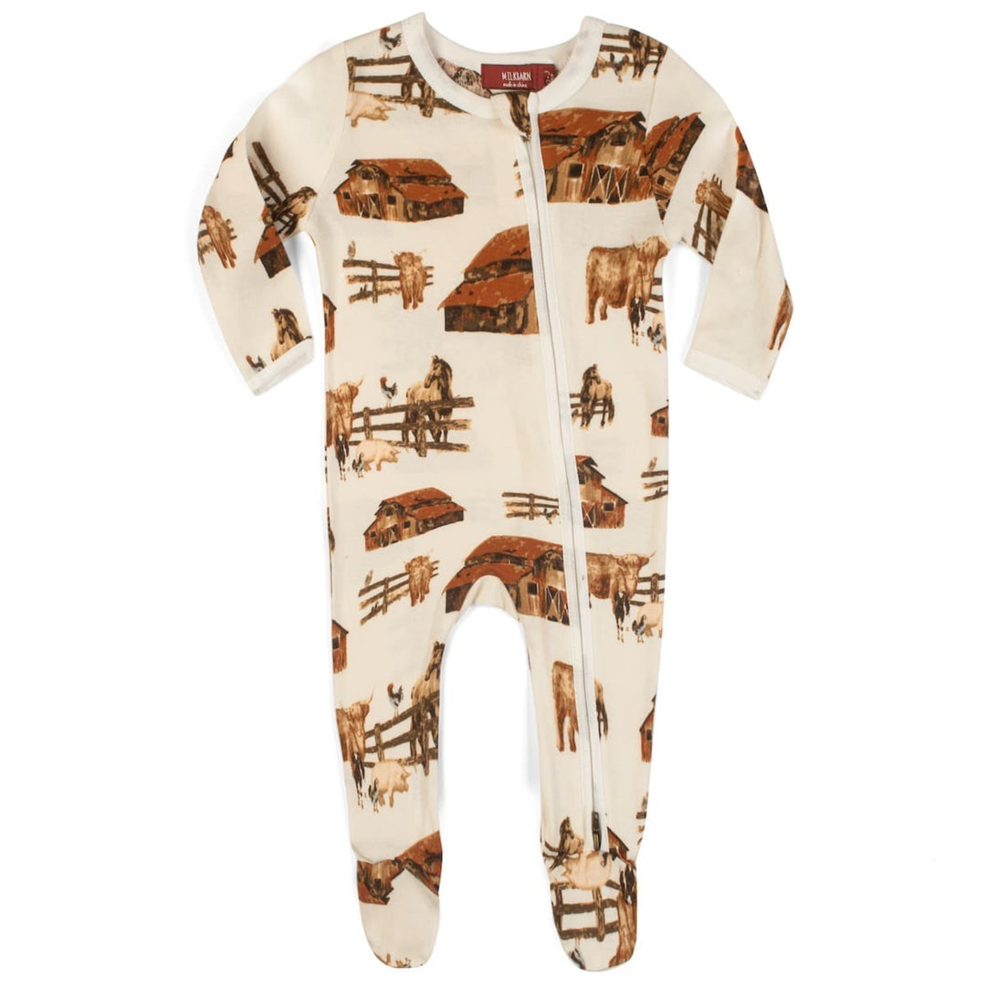 Baby onesie with farm animal pattern on a white background